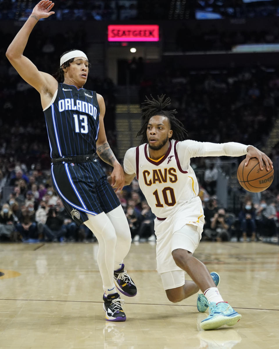 Cleveland Cavaliers' Darius Garland (10) drives against Orlando Magic's R.J. Hampton (13) in the second half of an NBA basketball game, Saturday, Nov. 27, 2021, in Cleveland. The Cavaliers won 105-92. (AP Photo/Tony Dejak)