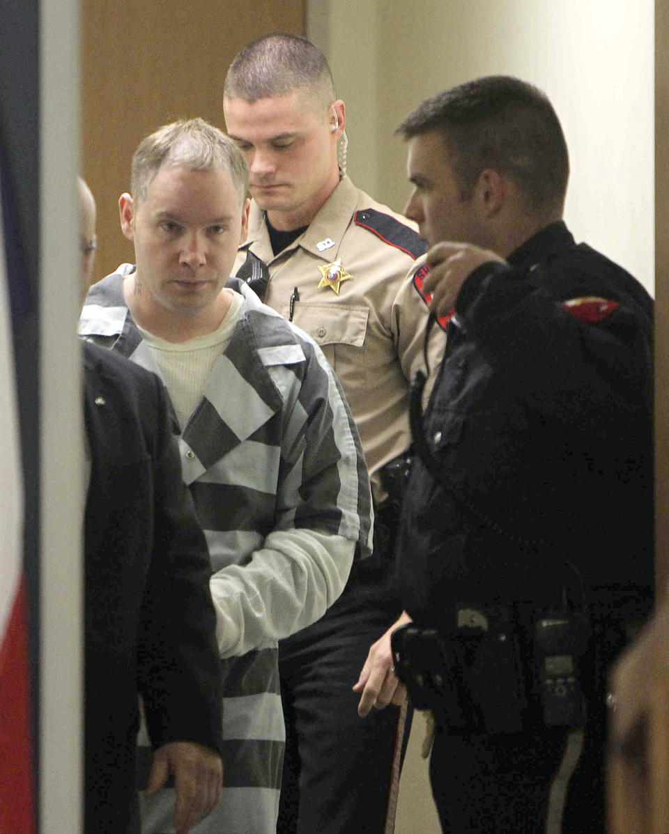 CORRECTS TO JUDGE HAMILTON, NOT COLLINS IN SECOND SENTENCE - Don Willburn Collins walks into the courtroom for a hearing at the 359th Judicial District Court with Judge Kathleen Hamilton on Thursday, March 6, 2014, in Conroe, Texas. Collins, now 28, accused of dousing Robert Middleton with gasoline and setting him on fire in 1998 when he was a teenager, can be tried as an adult for murder after the victim died from his burns nearly 13 years later, Judge Hamilton ruled Thursday. (AP Photo/ The Courier, Jason Fochtman) MANDATORY CREDIT