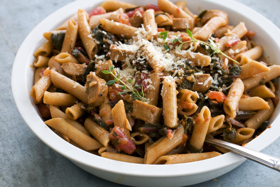 In this image taken on April 15, 2013, whole-wheat penne with spring greens and sausage is shown served in a bowl in Concord, N.H. (AP Photo/Matthew Mead)