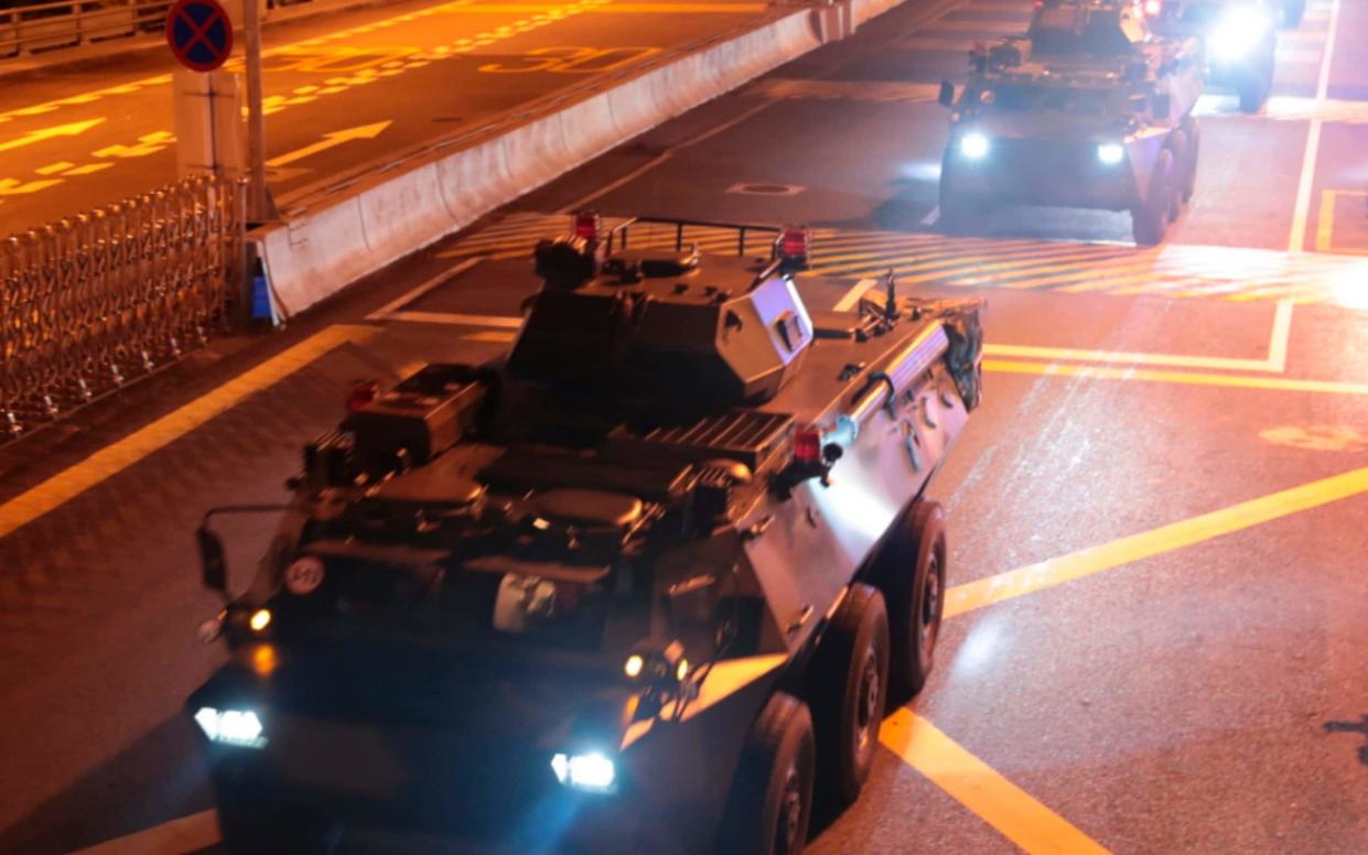 Armored personnel carriers of China's People's Liberation Army (PLA) pass through the Huanggang Port border between China and Hong Kong - Xinhua