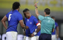 CORRECTS NAME OF PLAYER RECEIVING YELLOW CARD Referee Romain Poite shows Samoa's Rey Lee-lo, centre, a yellow card during the Rugby World Cup Pool A game between Russia and Samoa at Kumagaya Rugby Stadium, Kumagaya City, Japan, Tuesday, Sept. 24, 2019. (AP Photo/Jae Hong)