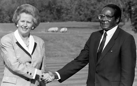 Margaret Thatcher with Robert Mugabe - Credit: Tim Ockenden/PA