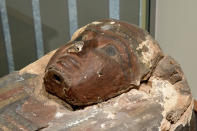 Detail of the face of the Cohen mummy, whose name may be "Amenirdis," at the new Johns Hopkins Archaeological Museum exhibit, "Who Am I? Remembering the Dead Through Facial Reconstruction", in Baltimore. FaceLab, Liverpool John Moores University, worked with Hopkins to create facial depictions of the Goucher mummy, ca. 4th c. BCE, and the Cohen mummy, ca. 664 - 525 BCE. (Amy Davis/The Baltimore Sun via AP)