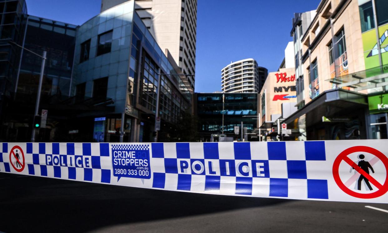 <span>Police tape outside the Westfield Bondi Junction shopping centre after the stabbing attack.</span><span>Photograph: David Gray/AFP/Getty Images</span>