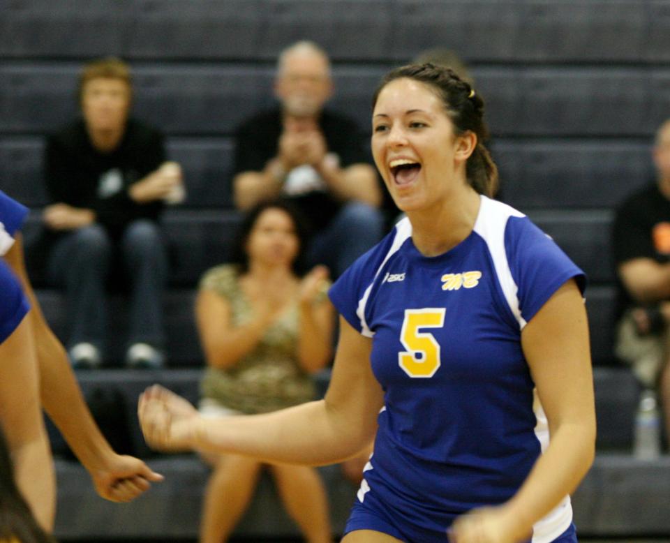 FILE -- Muncie Burris' Taylor Unroe celebrates a point against Ft. Wayne Northrop at the Muncie Burris Volleyball Invitational, Saturday, Sept. 5, 2009.