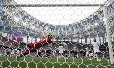 Soccer Football - World Cup - Quarter Final - Uruguay vs France - Nizhny Novgorod Stadium, Nizhny Novgorod, Russia - July 6, 2018 France's Raphael Varane scores their first goal REUTERS/Darren Staples