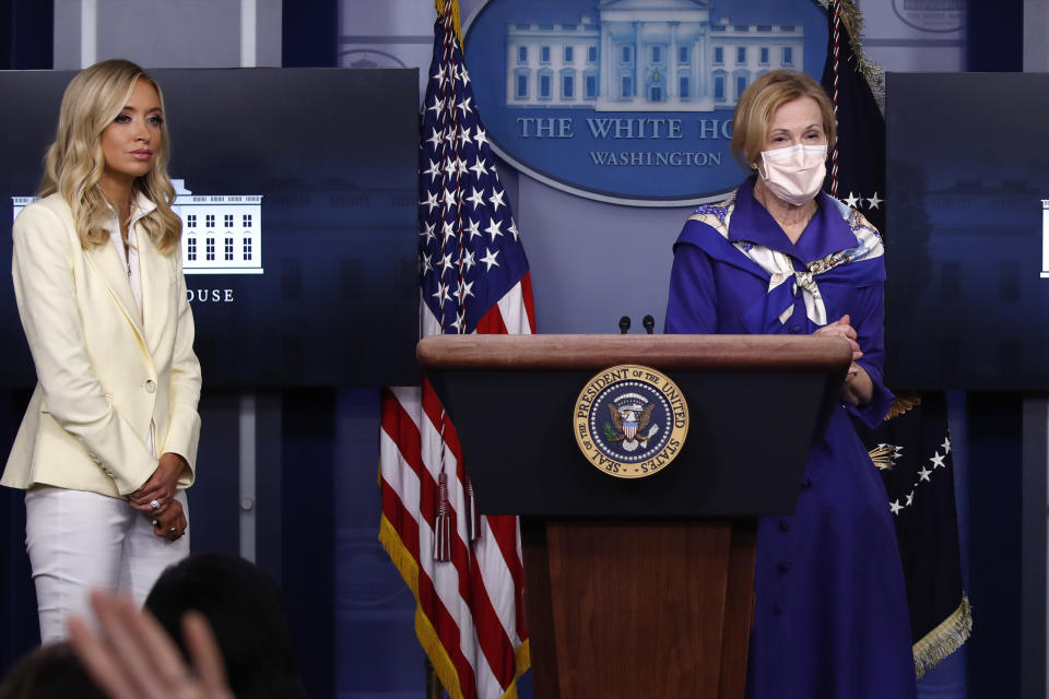 Dr. Deborah Birx, White House coronavirus response coordinator, speaks with reporters about the coronavirus in the James Brady Briefing Room of the White House, Friday, May 22, 2020, in Washington, as White House press secretary Kayleigh McEnany listens. (AP Photo/Alex Brandon)