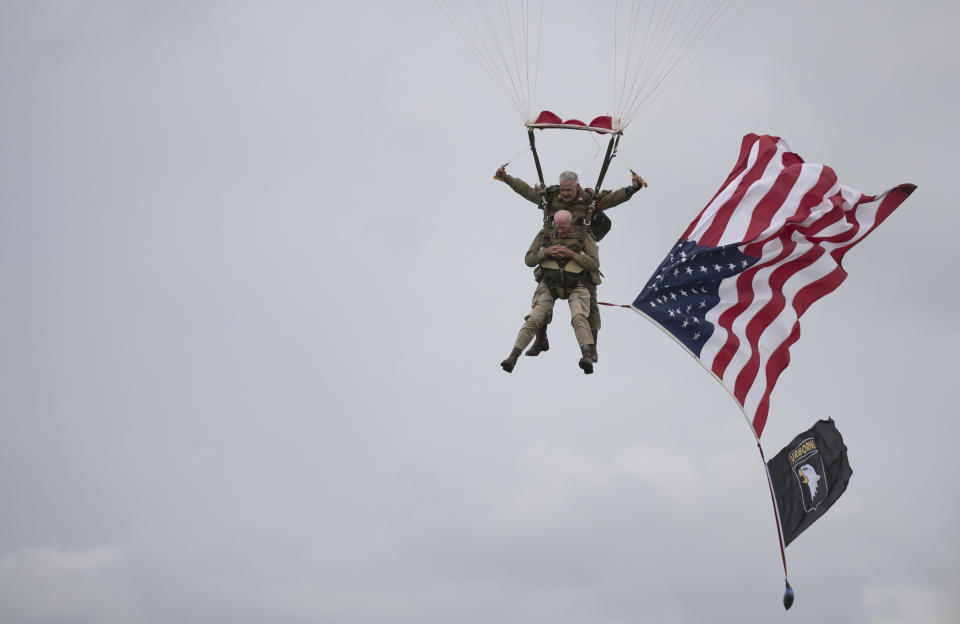 U.S. World War II D-Day veteran Tom Rice, from Coronado, CA, parachutes in a tandem jump into a field in Carentan, Normandy, France, Wednesday, June 5, 2019. Approximately 200 parachutists participated in the jump over Normandy on Wednesday, replicating a jump made by U.S. soldiers on June 6, 1944 as a prelude to the seaborne invasions on D-Day. (AP Photo)