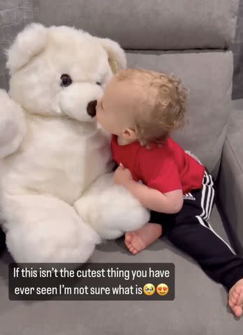 <p>Britanny Mahomes/Instagram</p> Brittany Mahomes son bronze kissing teddy bear.