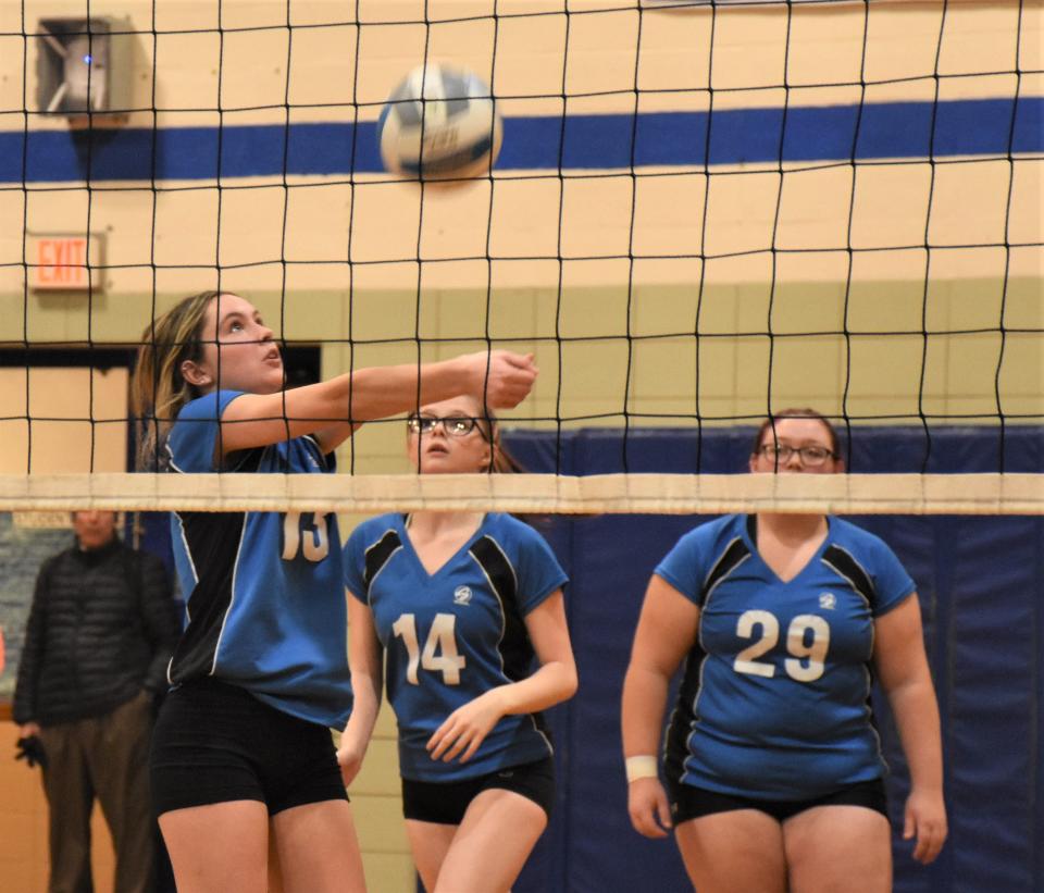 Reece Lamphere bumps the ball in front of Dolgeville Blue Devils teammates Lexus Lyon (14) and Raelynn Williams during the first round of the Section III playoffs against the Weedsport Warriors Wednesday.