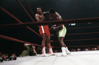 <p>Boxer Muhammad Ali, left, and Joe Frazier, center, shown in action at Madison Square Garden, New York on March 8, 1971. Ali knocked down by Joe Frazier, however Frazier won in the 15th round. Referee Art Mercante is shown on the right. (AP Photo)</p> 