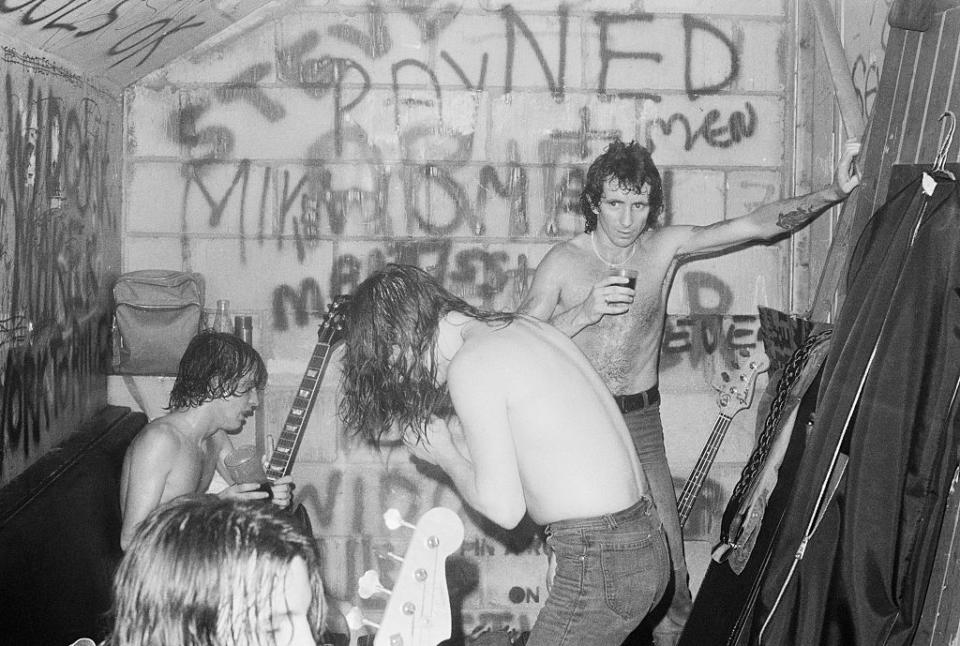 <p>AC/DC celebrates after a successful performance at the Marquee Club in London in 1976. </p>