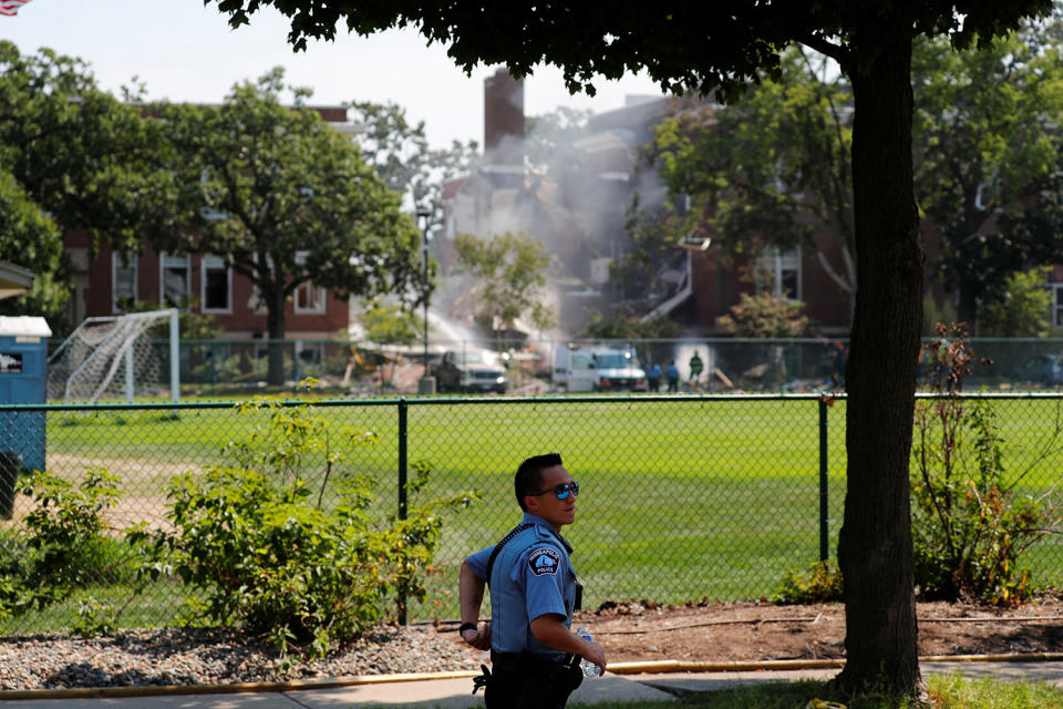 <p>Emergency personnel work the scene of a school building collapse at Minnehaha Academy in Minneapolis, Minnesota, August 2, 2017. (Adam Bettcher/Reuters) </p>