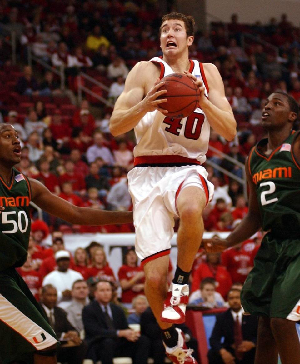 N.C. State’s Andrew Brackman (40) splits the Miami defense of Anthony King (50) and Gary Hamilton (2) for an easy basket during first half action at the RBC Center on Sunday, December 18, 2005