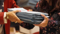 Tellers begin counting ballots for Virginia's Republican gubernatorial nominee race inside a ballroom at the Marriott Hotel in Richmond, Va., Monday, May 10, 2021. (Bob Brown/Richmond Times-Dispatch via AP)