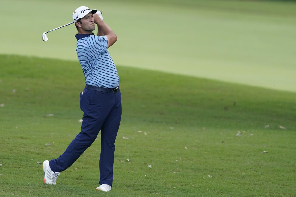 Jon Rahm, hits on the third fairway during the first round of the Tour Championship golf tournament at East Lake Golf Club in Atlanta, Friday, Sept. 4, 2020. (AP Photo/John Bazemore)