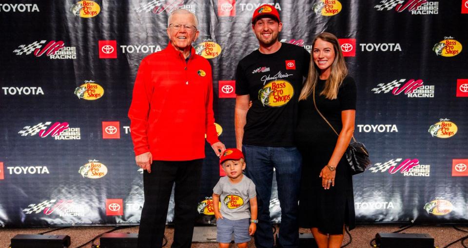 Joe Gibbs (L) poses with Chase Briscoe (C) and Chase\