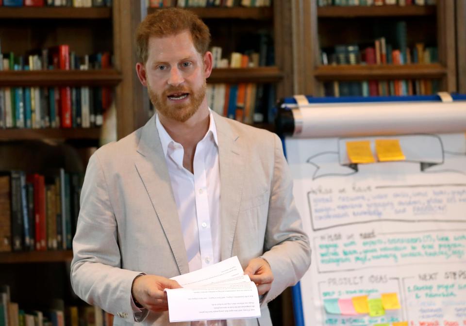 Prince Harry speaks to participants at Dr Jane Goodall's Roots & Shoots global leadership meeting at St. George's House, Windsor Castle, July 23, 2019.