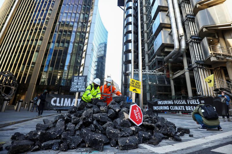 Extinction Rebellion activists protest outside the Lloyd's building in London