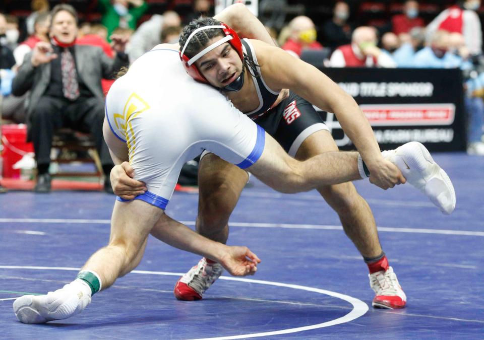 Lisbon junior Robert Avila Jr. battles Don Bosco senior Cael Rahnavardi in their Class 1A match at 145 pounds during the Iowa high school state wrestling tournament finals on Feb. 20, 2021.