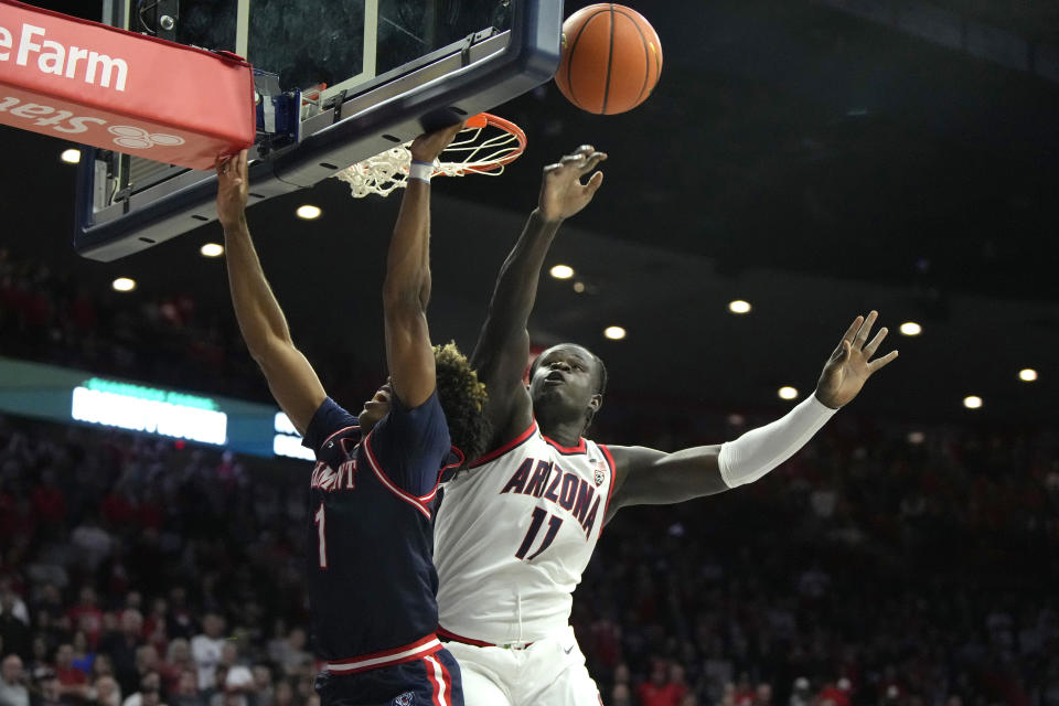 Arizona center Oumar Ballo (11) blocks a shot by Belmont guard Isaiah Walker during the first half of an NCAA college basketball game Friday, Nov. 17, 2023, in Tucson, Ariz. (AP Photo/Rick Scuteri)