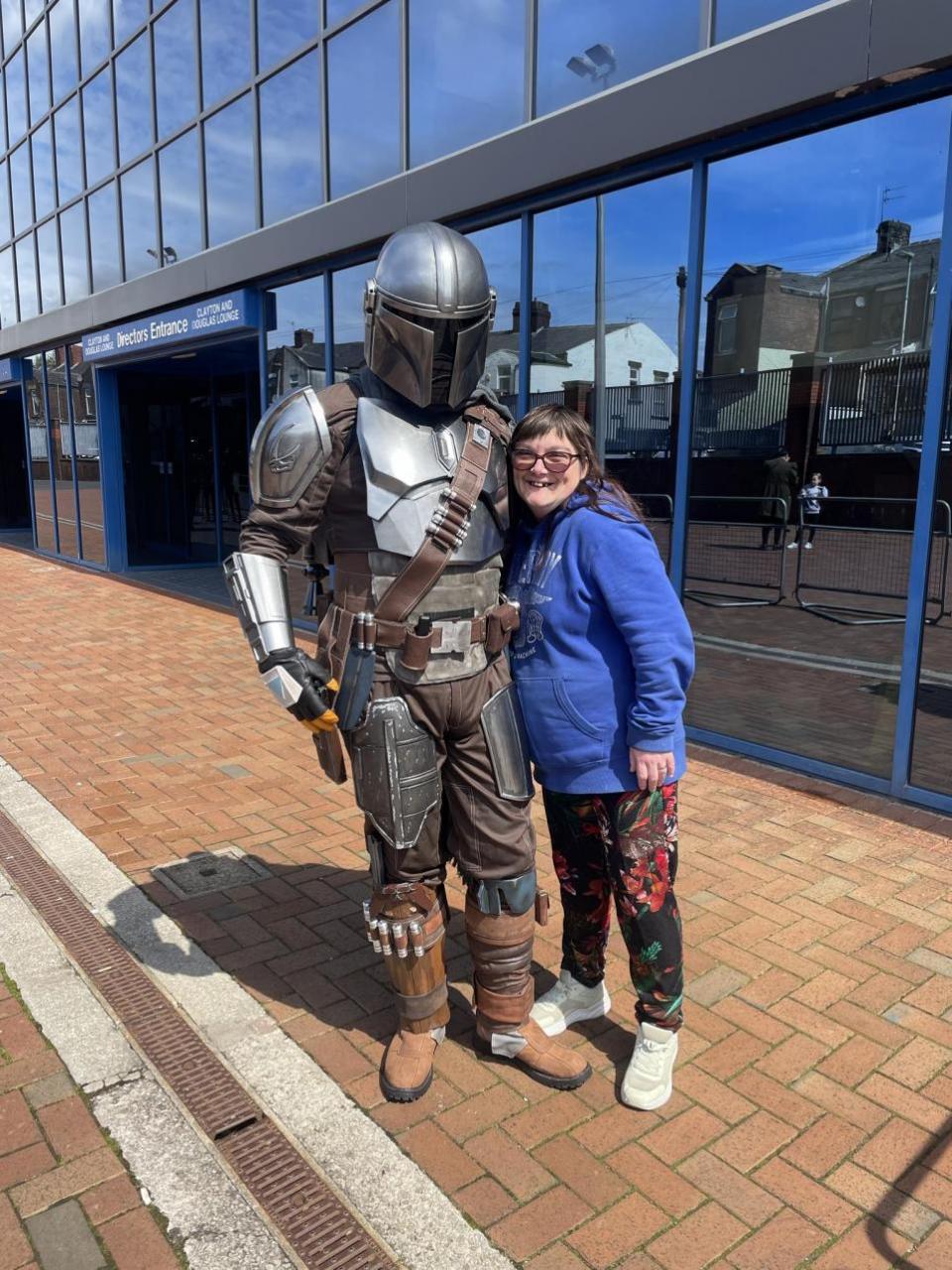 Lancashire Telegraph: Lyndsay Livesey, 42, from Darwen, with the Mandalorian outside Ewood Park