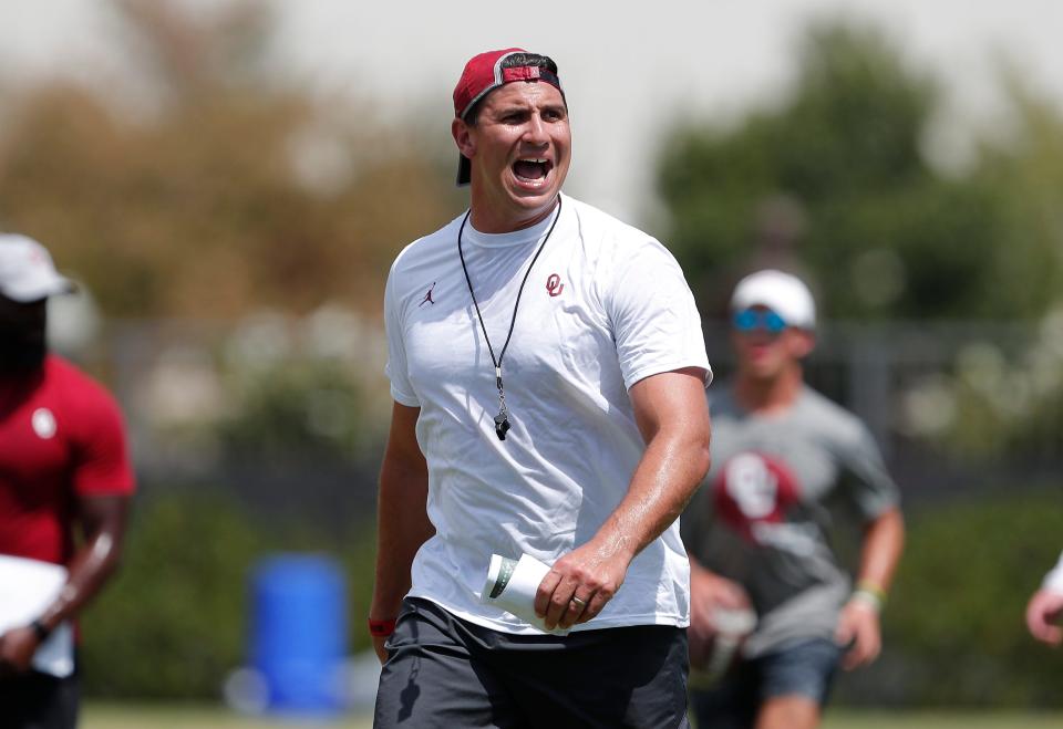 OU defensive ends coach Miguel Chavis watches the team during practice last August in Norman.