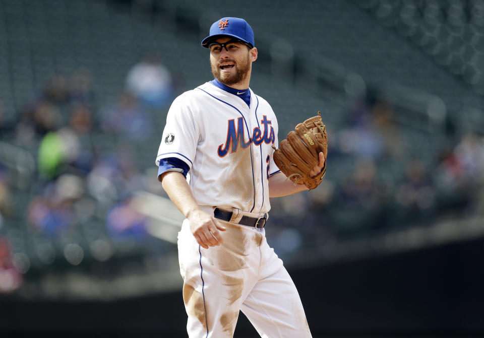 New York Mets' Daniel Murphy stands during the seventh inning of a baseball game against the Washington Nationals at Citi Field, Thursday, April 3, 2014, in New York. Murphy is proud he put fatherhood ahead of baseball, and New York Mets manager Terry Collins thinks criticism his second baseman received for taking paternity leave this week was unfair. Murphy made his season debut Thursday three days after the birth of son Noah. (AP Photo/Seth Wenig)