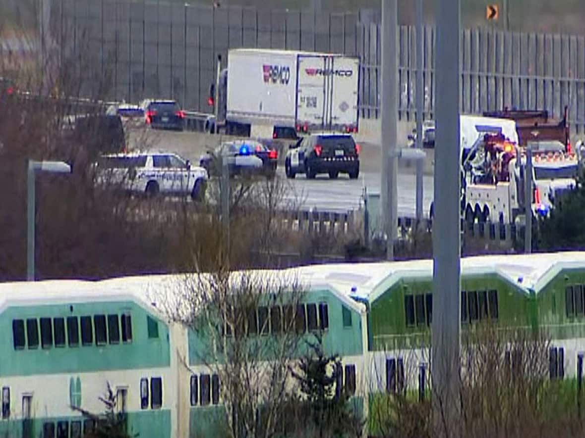 A view of the fatal crash on Highway 401 the day after the collision. Police closed a stretch of the highway for hours in both directions following the crash. (CBC - image credit)