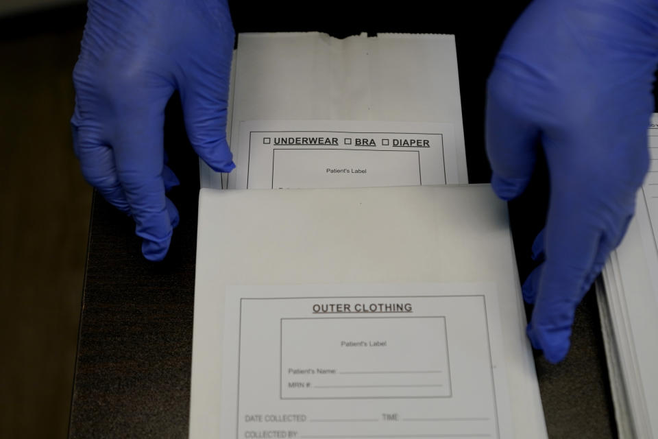 A Sexual Assault Evidence Collection Kit, or Rape Kit, is unpacked in an examination room, Wednesday, Aug. 31, 2022, in Austin, Texas. After a Texas law banning abortions past about six weeks, even in cases of rape or incest, went into effect a year ago, Gov. Greg Abbott said the state would strive to "eliminate all rapists from the streets." (AP Photo/Eric Gay)