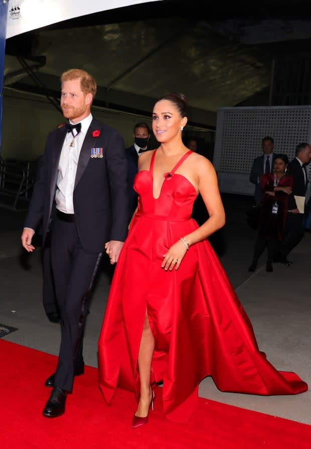 <p>Prince Harry was on hand as Meghan Markle rocked a vibrant red gown for the Intrepid Museum's annual Salute to Freedom Gala in November 2021. She was pictured at a fitting for the crimson Carolina Herrera number in their Netflix docuseries <em>Harry & Meghan</em>.</p><p>Theo Wargo/Getty Images for Intrepid Sea, Air, & Space Museum</p>