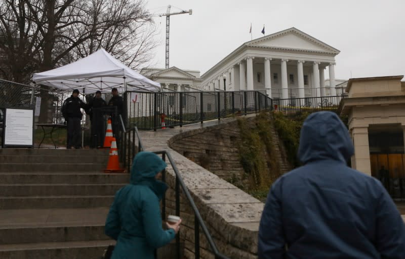 Law enforcement manage a security checkpoint to access the Virginia State Capitol grounds ahead of a gun rights advocates and militia members rally in Richmond, Virginia