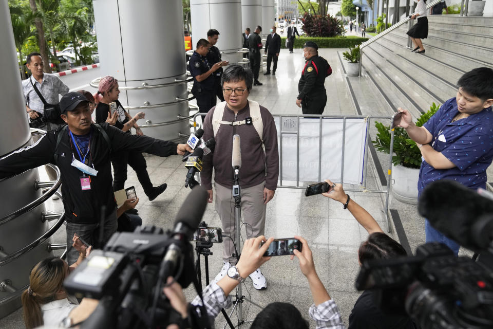 Arnon Nampa talks to the media on the arrival at the Criminal court to hear his first verdict in his trial, Tuesday, Sept. 26, 2023. The prominent Thai human rights lawyer was convicted on Tuesday of insulting the monarchy and sentenced to four years in prison, the first conviction under a controversial law guarding the royal institution since a civilian government took office after years of military-backed rule. (AP Photo/Sakchai Lalit)