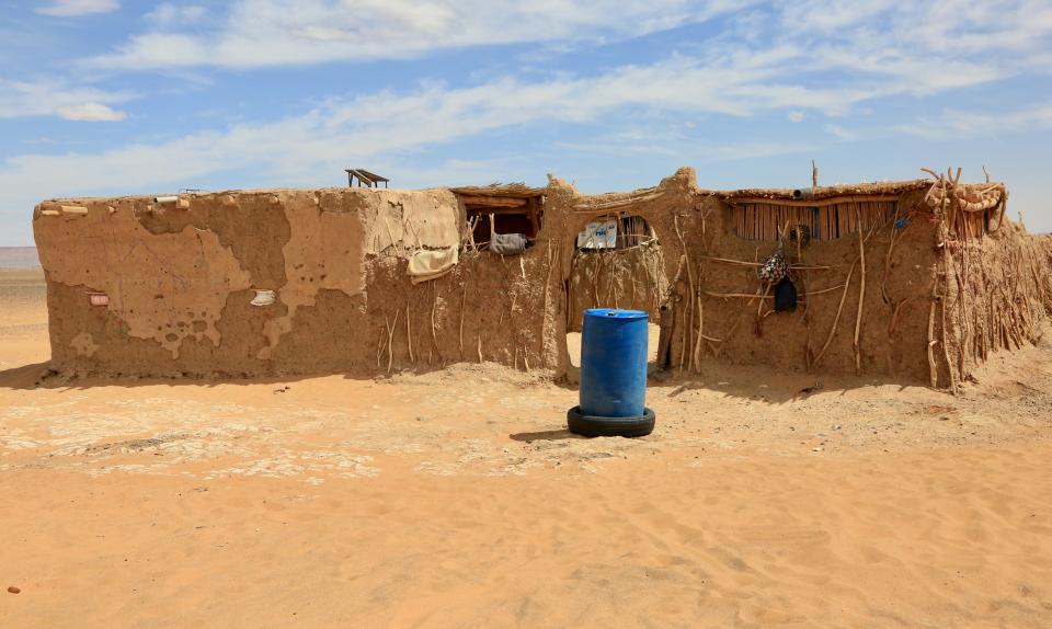 The home of Aamar, 78, one of the hosts on our visit to Morocco where he lived with his son, daughter-in-law and three children. Though his tribe is nomadic, he settled there after losing his wife. The family’s living quarters were as simple as their way of life was ancient. A five-foot wall of baked mud, high enough to keep out the animals, enclosed three rooms and a small courtyard that was hung with wash when we visited.