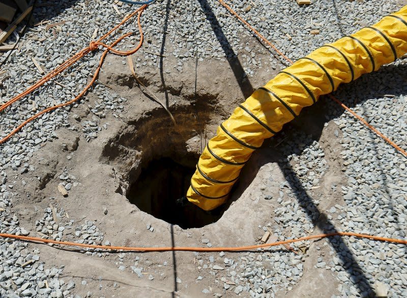 An air vent helps authorities with their investigation after the discovery of a cross-border tunnel from Tijuana, Mexico to Otay Mesa, California April 20, 2016.    REUTERS/Mike Blake