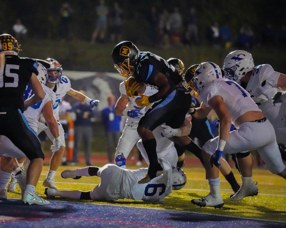 Moeller's Jordan Marshall scores his first touchdown of the night during an OHSAA playoff game against St. Xavier Friday, Nov. 4, 2022, at Norwood High School.