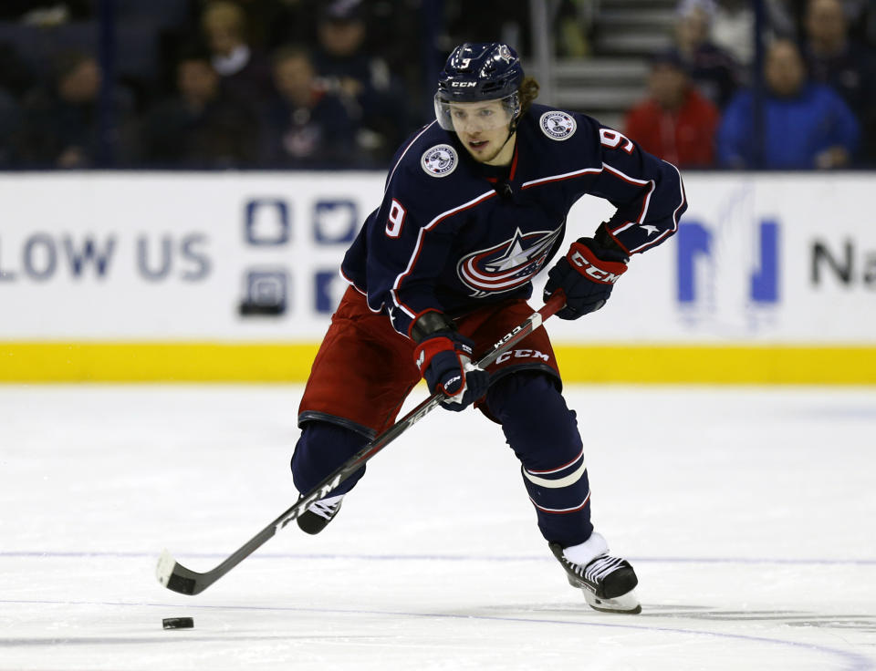 FILE - In this Dec. 11, 2018, file photo, Columbus Blue Jackets forward Artemi Panarin, of Russia, skates with the puck during an NHL hockey game against the Vancouver Canucks in Columbus, Ohio. After the offseason additions of star winger Artemi Panarin and defenseman Jacob Trouba, goaltender Henrik Lundqvist says the New York Rangers have to set their own realistic expectations for themselves this season. That process is one of several things to watch around the NHL when training camps open Thursday. (AP Photo/Paul Vernon, File)