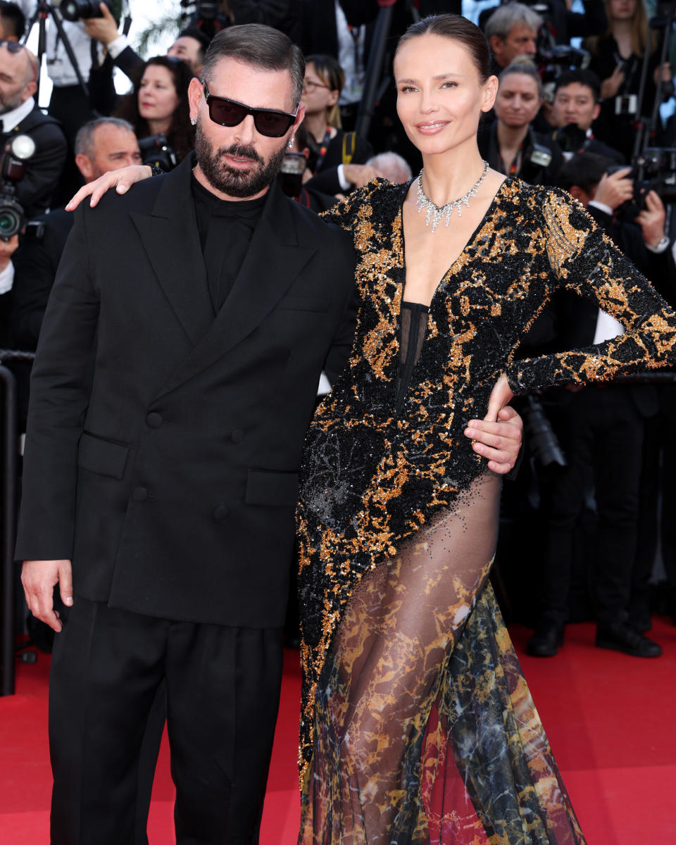 CANNES, FRANCE - MAY 19: Fausto Puglisi and Natasha Poly attend the "Horizon: An American Saga" Red Carpet at the 77th annual Cannes Film Festival at Palais des Festivals on May 19, 2024 in Cannes, France. (Photo by Pascal Le Segretain/Getty Images)