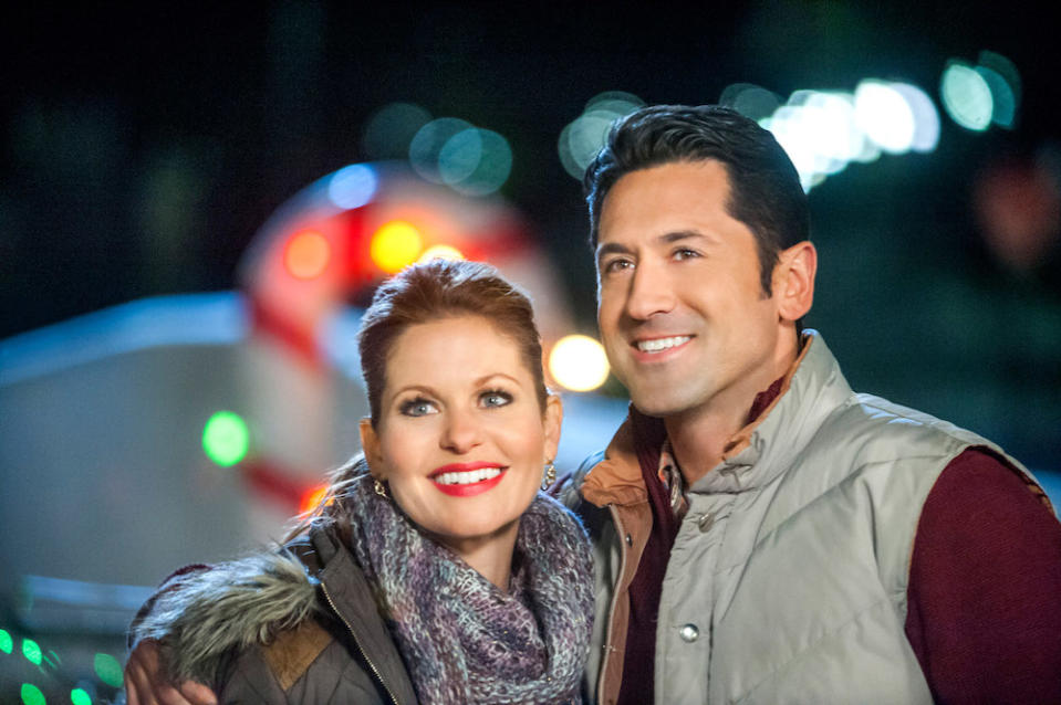 CHRISTMAS UNDER WRAPS - When a driven doctor doesn't get the prestigious position she planned for, she unexpectedly finds herself moving to a remote Alaskan town.  Photo: Candace Cameron Bure, David O'Donnell  Photo Credit: Copyright 2014 Crown Media United States LLC/Photographer: Fred Hayes