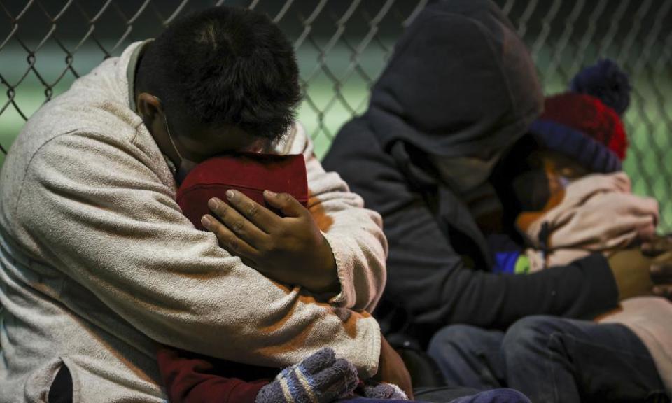 Migrants from Honduras, Guatemala and El Salvador wait to board the bus after crossing the Rio Grande river from Mexico aboard to US, in La Joya, Texas on 8 April 2021.