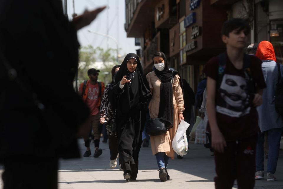 Iranian women walk on a street amid the implementation of the new hijab surveillance in Tehran, Iran, April 15, 2023. Majid Asgaripour/WANA (West Asia News Agency) via REUTERS