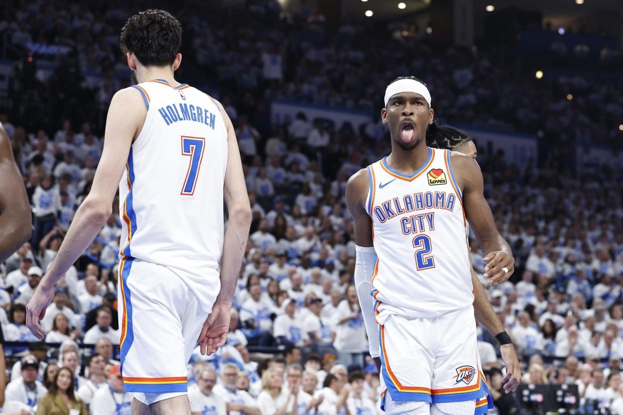 Apr 21, 2024; Oklahoma City, Oklahoma, USA; Oklahoma City Thunder guard Shai Gilgeous-Alexander (2) reacts to forward Chet Holmgren (7) blocking a shot by a New Orleans Pelicans player during the second quarter of game one of the first round for the 2024 NBA playoffs at Paycom Center. Mandatory Credit: Alonzo Adams-USA TODAY Sports