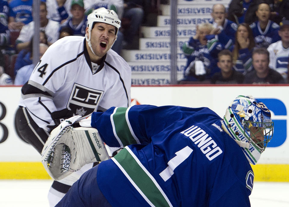 VANCOUVER, CANADA - APRIL 13: Dwight King #74 of the Los Angeles Kings reacts after shooting wide of an open net as goalie Roberto Luongo #1 of the Vancouver Canucks scrambles to make a save during the first period in Game Two of the Western Conference Quarterfinals during the 2012 NHL Stanley Cup Playoffs at Rogers Arena on April 13, 2012 in Vancouver, British Columbia, Canada. (Photo by Rich Lam/Getty Images)