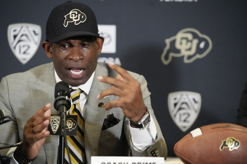 FILE - Deion Sanders speaks after being introduced as the new head football coach at the University of Colorado during a news conference Sunday, Dec. 4, 2022, in Boulder, Colo. By the end of the spring, Sanders had cut more than 50 players and another 20 left on their own in what is believed to be the biggest roster overhaul ever. Most of the displaced players entered the transfer portal. Some walked away from football. (AP Photo/David Zalubowski, File)