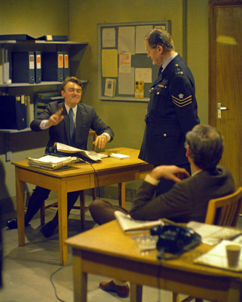 Storylines in Dixon of Dock Green became more up to date as the 60s progressed, and the focus moved from Sergeant Dixon (standing), played by Jack Warner, to the younger detective Crawford (seated at desk), played by Peter Byrne.