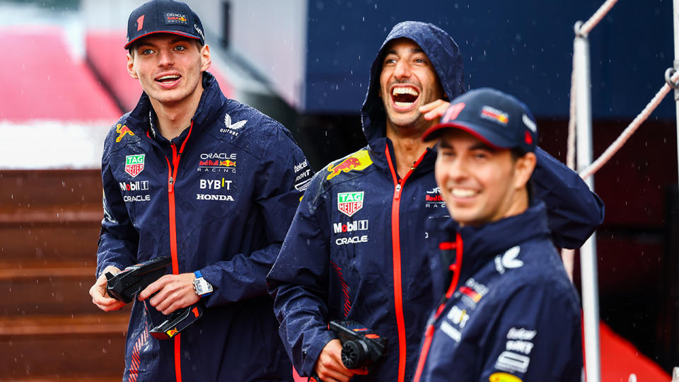 Daniel Ricciardo is pictured laughing in between Red Bull drivers Max Verstappen and Sergio Perez.