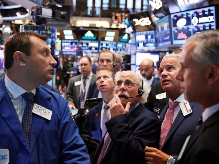 Traders work on the floor of the New York Stock Exchange (NYSE) shortly after the opening bell in New York, U.S., August 30, 2016.  REUTERS/Lucas Jackson/File Photo