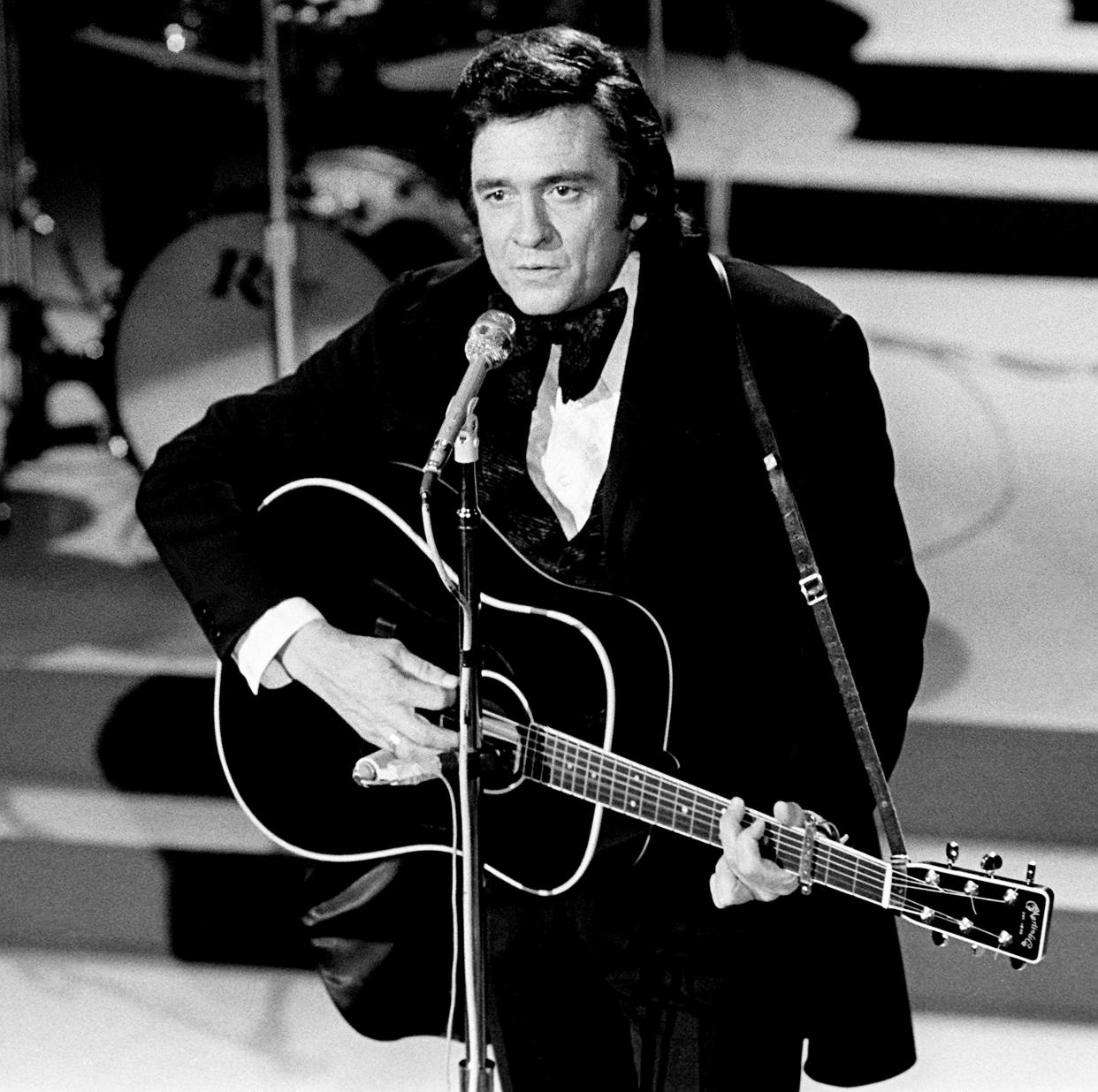 Host Johnny Cash performs for the crowd during the seventh annual CMA Awards show at the Grand Ole Opry House on Oct. 15,1973.