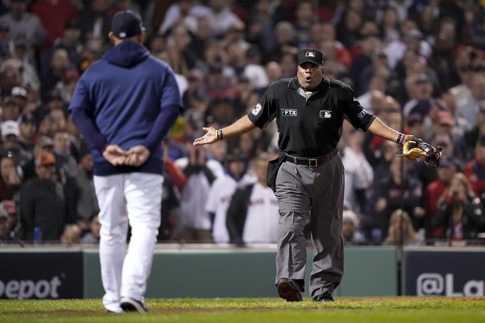 Boston Red Sox manager Alex Cora argues a call with home plate umpire Laz Diaz during the third inning in Game 4 of baseball's American League Championship Series Houston Astros Tuesday, Oct. 19, 2021, in Boston. (AP Photo/David J. Phillip)