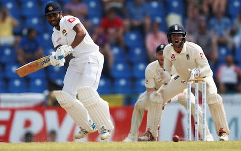 Roshen Silva hits a shot against England  - Credit: Reuters